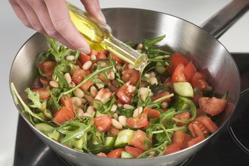 Sprinkling sweated vegetables with oil