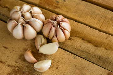 Garlic on the wooden background, Close up garlic on wooden table, Raw garlic in kitchen rooms.