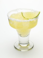 Frozen Margarita with lime wedge