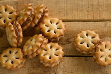 Close up of home made cookies on a wooden table, Sweet cookies on wooden background, 