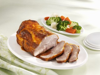 Roast pork with gravy and a side salad