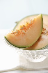 Charentais melon in glass dish