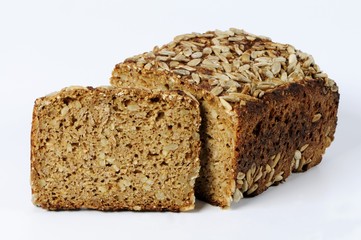 Whole-grain bread with sunflower seeds, partly sliced