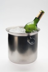 A bottle of white wine in a wine cooler