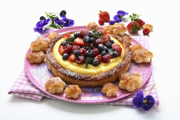 A puff pastry cake with vanilla cream and berries