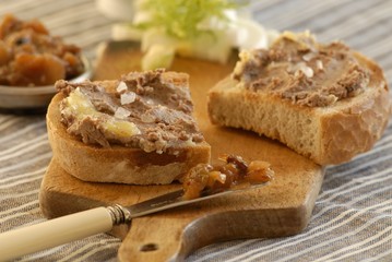 Bread topped with liver pate and chutney