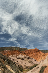 Clouds and colored mountains