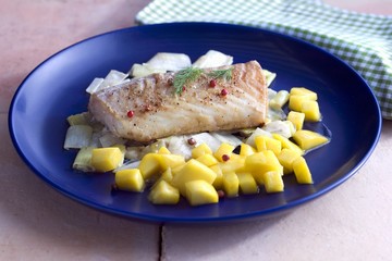 Cod on a leek medley with mango salsa