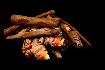 Cinnamon and Turmeric on Black Background