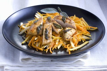 Chicken breast with sage on a carrot and celery medley