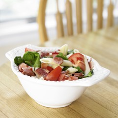 Penne Pasta with Tomatoes, Bacon and Spinach in a Bowl