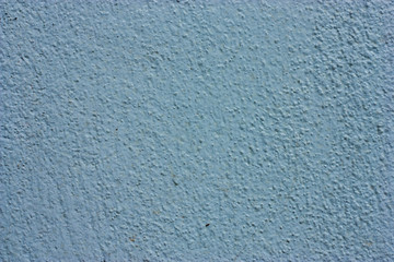 Textured walls with dirt.