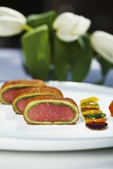 Saddle of lamb with a bread and ramson crust and a side of vegetables