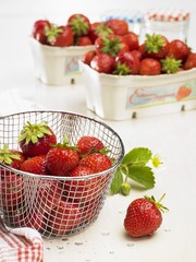 Fresh strawberries in a wire basket