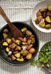 Fried potatoes with garlic and lives in a pan