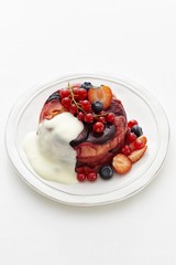 Berry pudding with vanilla sauce