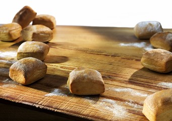 Bread rolls on a wooden table