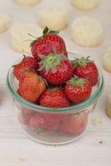 Fresh strawberries and round slices of cake (ingredients for push-up cake pops)