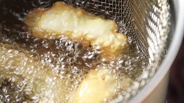 Fish fillets in a frying basket