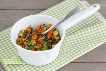 Steamed vegetables: courgette, spring onions, orange pepper
