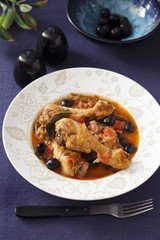 Chicken legs with olives in tomato sauce