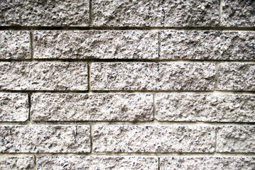 front view of a black - grey brick wall