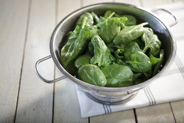 Fresh spinach in a colander