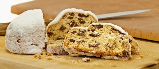 Stollen, sliced, on a chopping board
