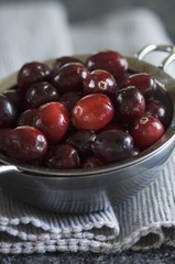 Cranberries in a metal sieve