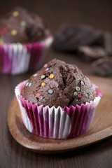 Chocolate muffins with decorative sprinkles
