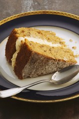 A slice of parsnip cake with maple syrup