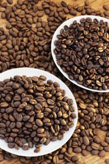 Coffee beans in and around plates