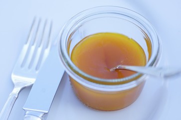Apricot jam in jar with spoon