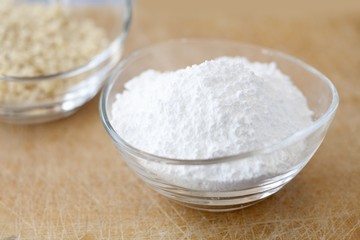 Icing sugar in a small glass bowl