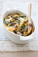 Aubergine and spinach bake in a casserole dish