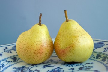 Two pears on a porcelain plate