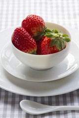 Strawberries in a porcelain teacup