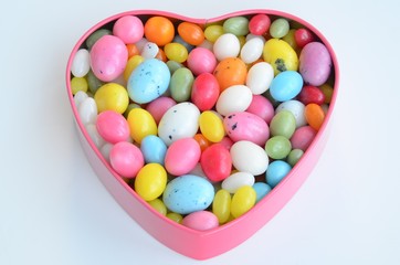 A heart-shaped tin of colourful sugar eggs