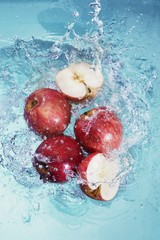 Apples falling into water