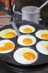 Poached eggs in a pan