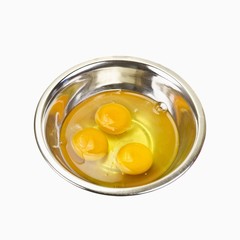 Cracked eggs in a metal bowl