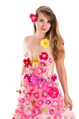 Obraz na płótnie Canvas beautiful woman in a dress from flowers