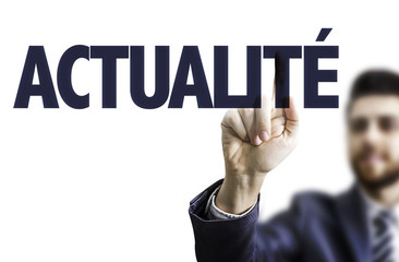 Business man pointing the text: News (in French)