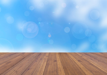 Abstract blue sky and beautiful bright bokeh background and wooden floor
