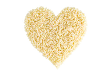 Heart shape made of couscous viewed from above, isolated on white background.