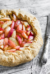 Apple pie on a light wooden surface