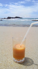 Glass juice on the beach