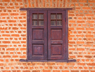 Vintage window on Red brick wall background
