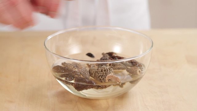 Black morels being softened