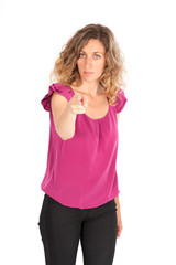 Fototapeta premium Beautiful woman doing different expressions in different sets of clothes: gun sign